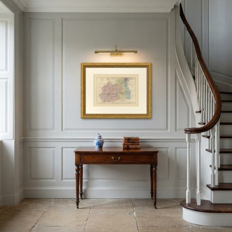 Antique Map of Surrey with Guildford, Reigate and Croydon, 1885, shown framed in a room