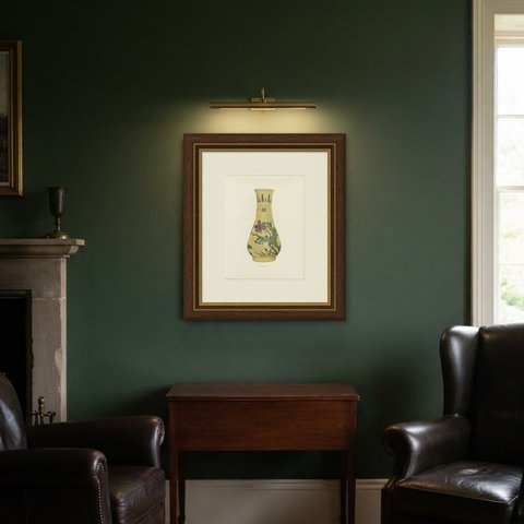 Late Ming Yellow Ground Vase with Engraved Prunus, Magnolia and Peony, 1911, shown framed in a room