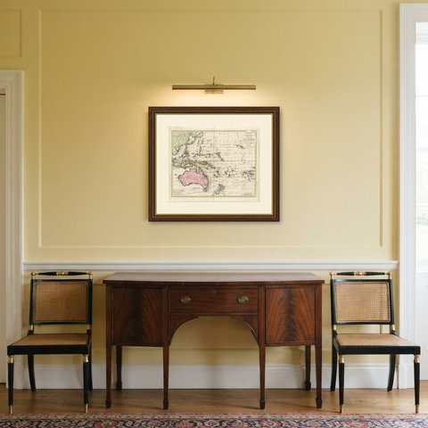 Antique Map of Australia and Polynesia with Cook's Voyages, Walch, 1802, shown framed in a room