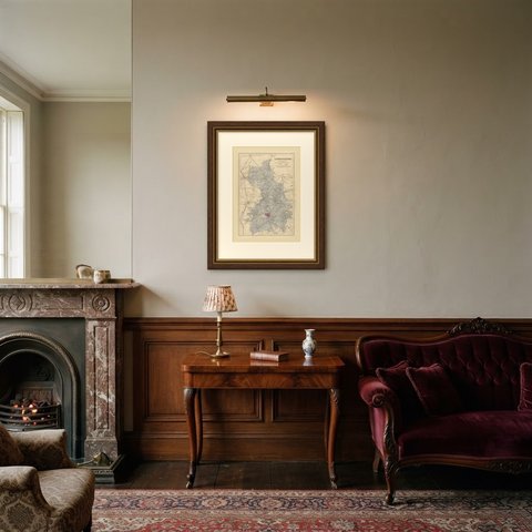 Antique Map of Cambridgeshire with Peterborough and Huntingdon, 1885, shown framed in a room
